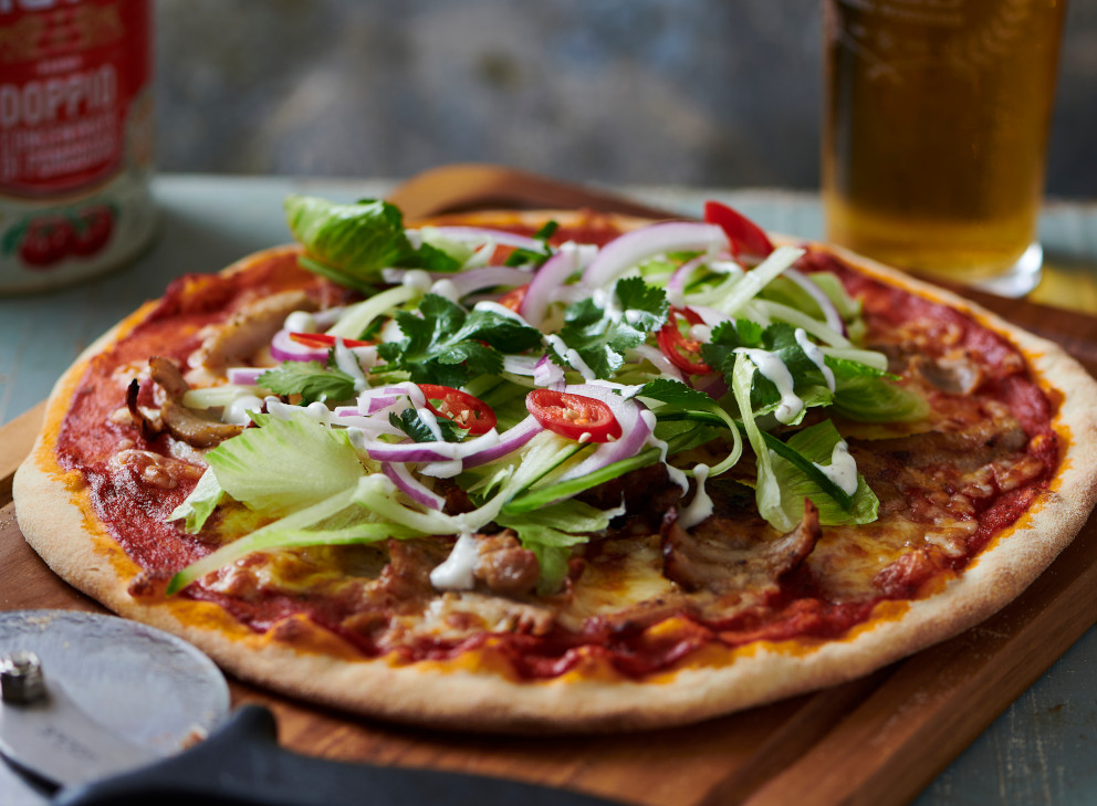 homemade fresh pizza on wooden table