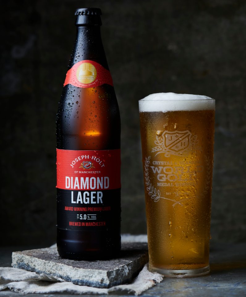 Diamond Lager Bottle with pint glass of beer