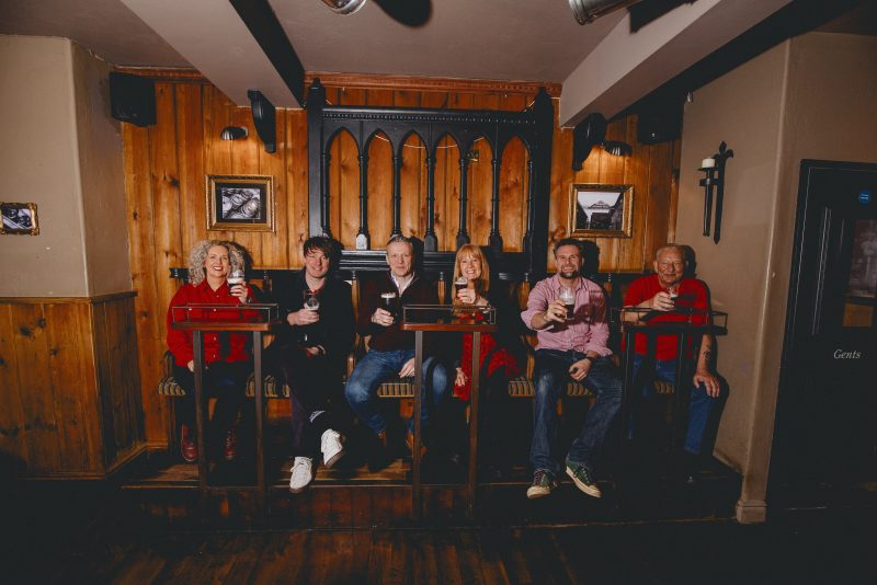 http://Six%20friends%20enjoying%20pints%20of%20Joseph%20Holt's%20Bitter
