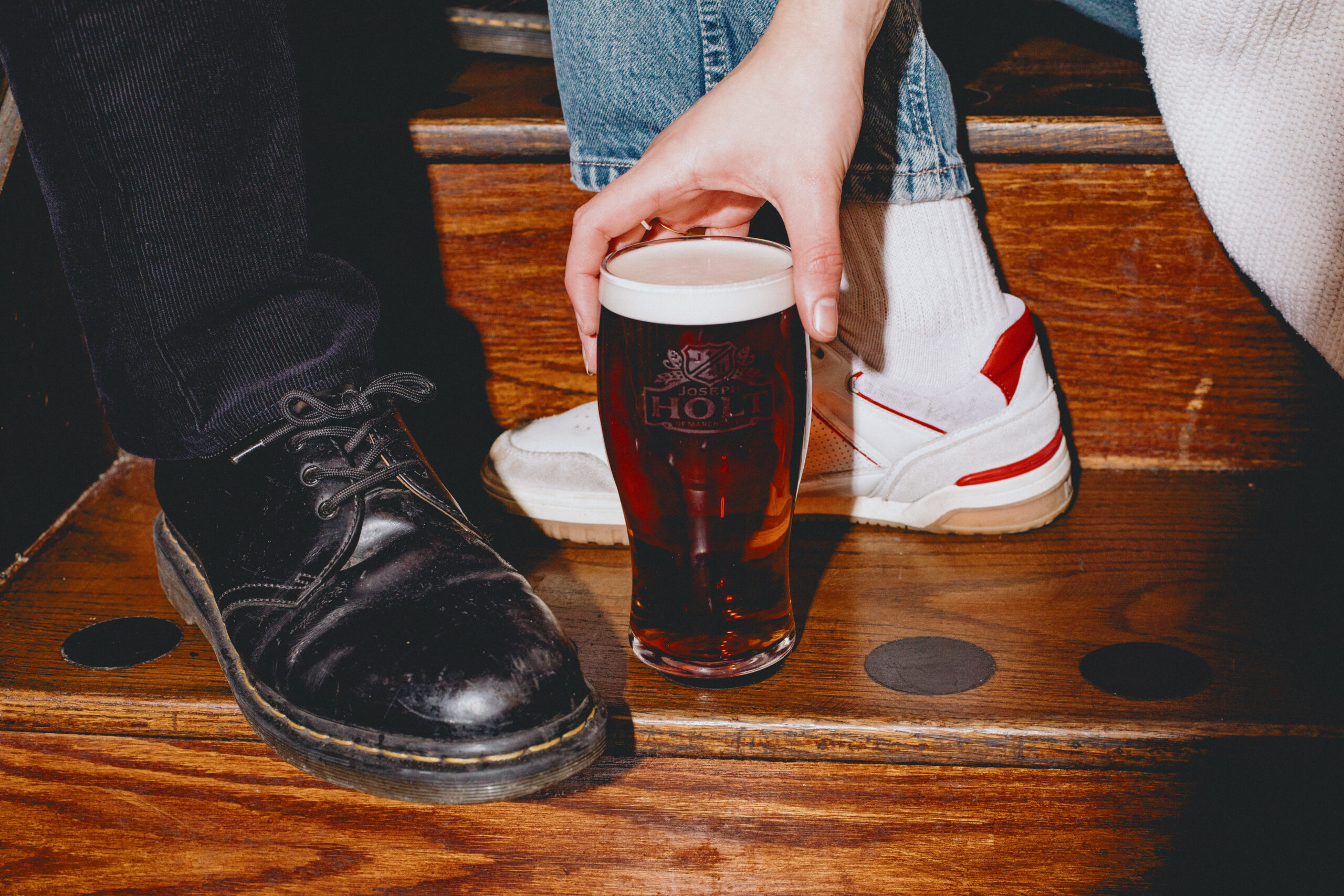 A pint of Bitter on stairs with dr mertens.