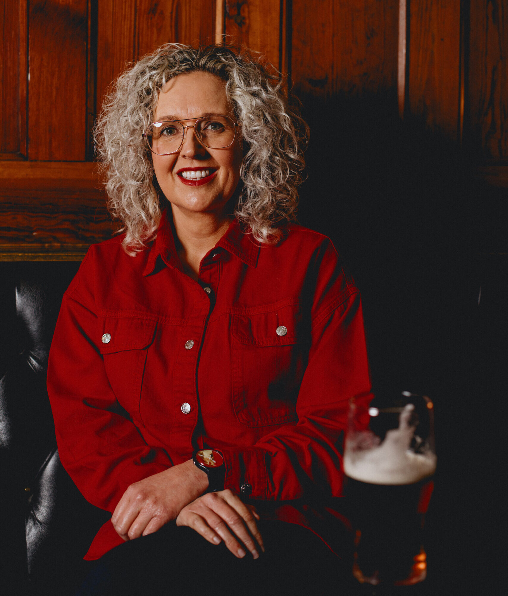 A woman dressed in red sat down.